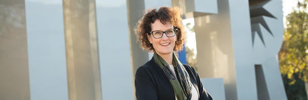 CNAS Dean Kathryn Uhrich in front of UCR sign (c) UCR / Carrie Rosema
