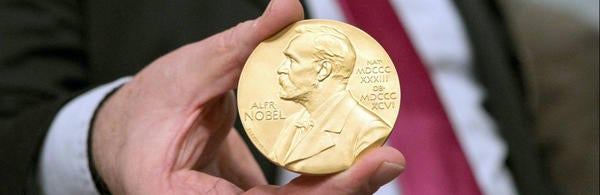 Nobel Prize Medal in hand, source: Princeton