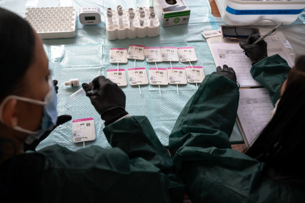 Preparing swab samples at a testing site in San Francisco on Tuesday.Credit...Mike Kai Chen for The New York Times