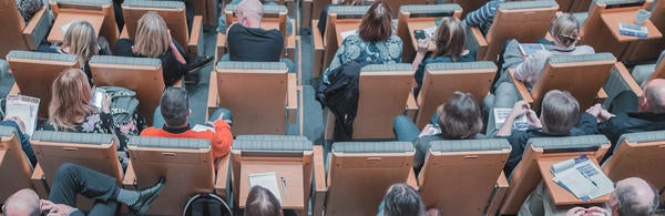 (c) Mikael Kristenson 242070 unsplash - people in chairs in an event hall