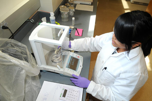 student working with equipment in Earth Science lab (c) UCR / CNAS