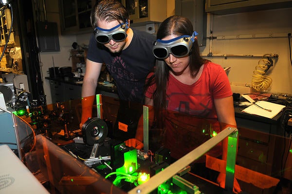 (c) UCR/CNAS - students looking at lasers with goggles on