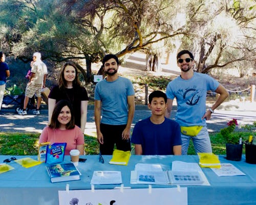 students at table during Plant Pathology Outreach event (c) UCR