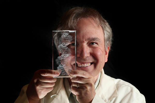 (c) UCR/Stan Lim - Botanist holding specimen