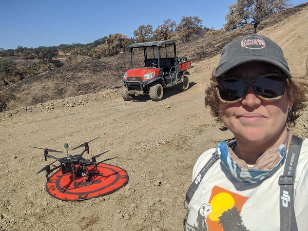 CHI coordinator Becca Fenwick conducting a post-fire drone flyover of Blue Oak Ranch Reserve. Image: Becca Fenwick